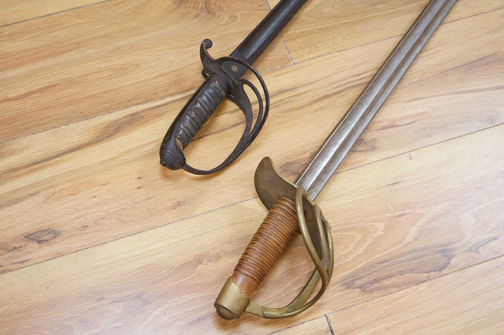 A Victorian Royal Artillery officer’s sword in poor condition and a copy of a French 1813 Cuirassier’s sword (2)